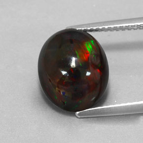 3.84캐럿 천연 멀티컬러 블랙 오팔, 타원형 컷, 12.2×10.1 mm, 불투명체
