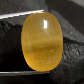 40.17캐럿 천연 오렌지 칼사이트, 타원형 컷, 24.6×17.4 mm, 투명한