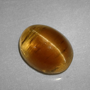 3.32캐럿 천연 허니 Cat's Eye Apatite, 타원형 컷, 9.3×7.2 mm, 투명한
