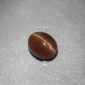1.47캐럿 천연 허니 Cat's Eye Apatite, 타원형 컷, 7×5.7 mm, 투명한