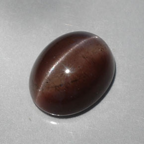 5.30캐럿 천연 다크 브라운 Cat's Eye Scapolite, 타원형 컷, 12.1×9.6 mm, 투명한