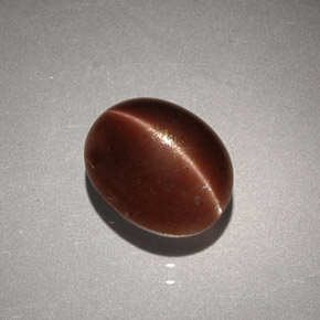 2.56캐럿 천연 브라운 Cat's Eye Scapolite, 타원형 컷, 9.1×7.3 mm, 불투명체