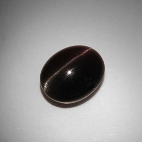 11.50캐럿 천연 다크 브라운 Cat's Eye Scapolite, 타원형 컷, 15×12.1 mm, 투명한