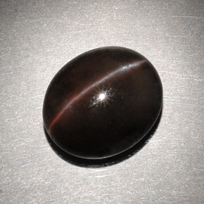 6.82캐럿 천연 다크 브라운 Cat's Eye Scapolite, 타원형 컷, 13×11.2 mm, 투명한