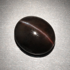 6.82캐럿 천연 다크 브라운 Cat's Eye Scapolite, 타원형 컷, 13×11.2 mm, 투명한