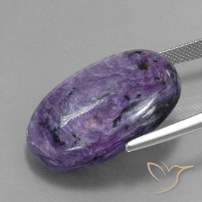 34.07캐럿 천연 모브 바이올렛 차로아이트, 타원형 컷, 27.9×21.2 mm, 불투명체