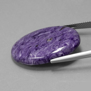 27.59캐럿 천연 제비꽃 차로아이트, 타원형 컷, 불투명체