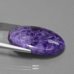 27.61캐럿 천연 바이올렛 차로아이트, 타원형 컷, 30.3×22.3 mm, 불투명체