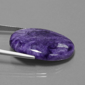 26.43캐럿 천연 바이올렛 차로아이트, 타원형 컷, 30.1×21.9 mm, 불투명체