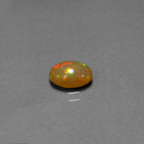 0.68캐럿 천연 멀티컬러 초콜릿 오팔, 투명한, 7.9×5.9 mm, 투명/반투명