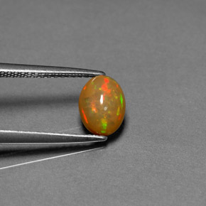 0.68캐럿 천연 멀티컬러 초콜릿 오팔, 투명한, 7.9×5.9 mm, 투명/반투명