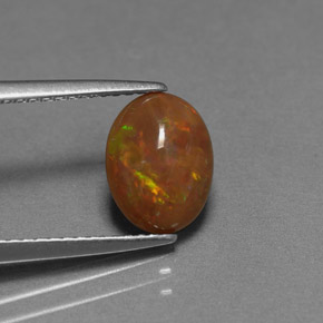 0.83캐럿 천연 멀티컬러 초콜릿 오팔, 타원형 컷, 9.1×6.9 mm, 불투명체