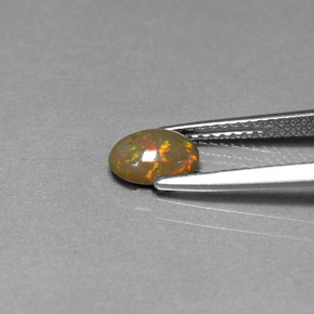 0.46캐럿 천연 멀티컬러 초콜릿 오팔, 타원형 컷, 7.1×5.2 mm, 불투명체