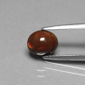 0.75캐럿 천연 멀티컬러 초콜릿 오팔, 타원형 컷, 7×5.8 mm, 불투명체