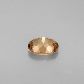 0.64캐럿 천연 골든 브라운에서 오렌지 컬러체인지 가넷, 타원형 컷, 5.8×4.6 mm, VVS-VS