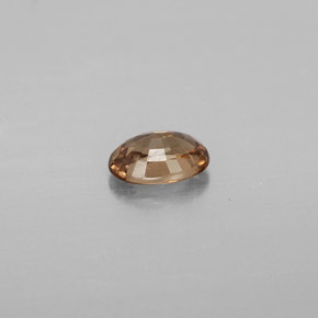 0.65캐럿 천연 녹갈색에서 레드핑크 컬러체인지 가넷, 타원형 컷, 6.1×4.1 mm, VVS