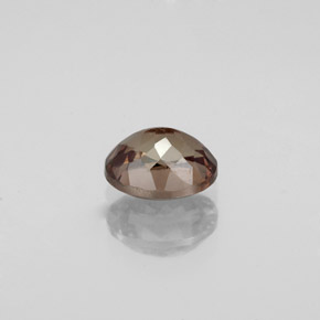 1.11캐럿 천연 골든 브라운에서 오렌지 컬러체인지 가넷, 타원형 컷, 6.5×5.2 mm, VS