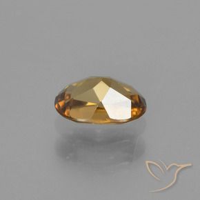 0.72캐럿 천연 골든 브라운 컬러체인지 가넷, 타원형 컷, 5.9×4 mm, VVS-VS