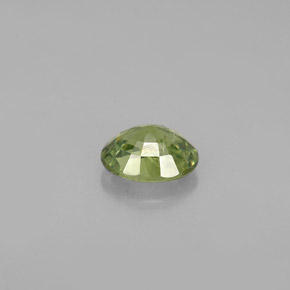 0.66캐럿 천연 골든 그린 데만토이드 가넷, 타원형 컷, 5.8×4.6 mm, VS-SI
