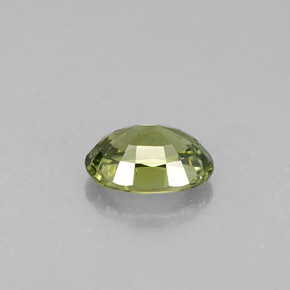 0.62캐럿 천연 골든 그린 데만토이드 가넷, 타원형 컷, 5.9×4.3 mm, VS