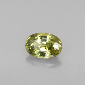 0.63캐럿 천연 골든 그린 데만토이드 가넷, 타원형 컷, 6×4.1 mm, VVS-VS