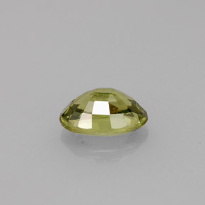 0.68캐럿 천연 골든 그린 데만토이드 가넷, 타원형 컷, 6.2×4.2 mm, VS