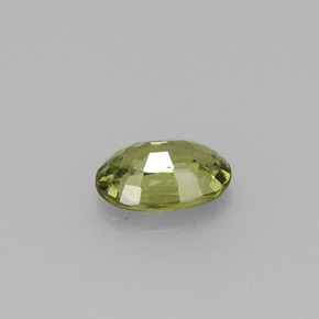 0.59캐럿 천연 골든 그린 데만토이드 가넷, 타원형 컷, 6.1×4.2 mm, VVS-VS