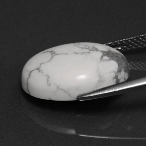 8.20캐럿 천연 회백색 하울라이트, 타원형 컷, 16.2×12.4 mm, 불투명체