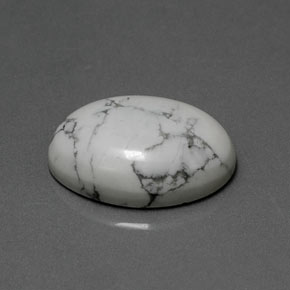 7.88캐럿 천연 회백색 하울라이트, 타원형 컷, 16.1×12.2 mm, 불투명체