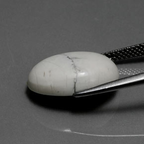 8.27캐럿 천연 회백색 하울라이트, 타원형 컷, 16.3×12.5 mm, 불투명체