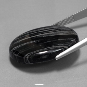 54.69캐럿 천연 회색 선이 있는 검정색 재스퍼, 타원형 컷, 32.8×26.2 mm, 불투명체
