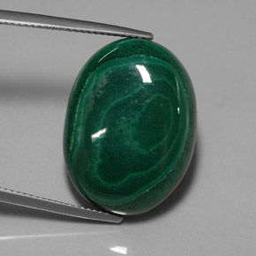 29.59캐럿 천연 여러 가지 빛깔의 녹색 말라카이트, 타원형 컷, 23.4×17.2 mm, 불투명체