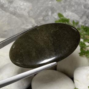 31.63캐럿 천연 골드쉰블랙 흑요석, 타원형 컷, 불투명체