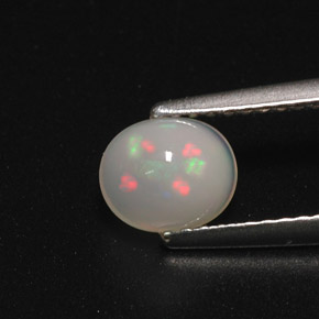 0.70캐럿 천연 멀티컬러 오팔, 타원형 컷, 6.6×5.6 mm, 투명한