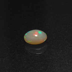 0.58캐럿 천연 멀티컬러 오팔, 타원형 컷, 7.1×5.2 mm, 투명한