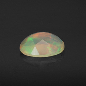 0.74캐럿 천연 멀티컬러 오팔, 타원형 컷, 8.2×6.2 mm, 투명한