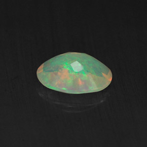 0.65캐럿 천연 멀티컬러 오팔, 투명한, 7.8×5.8 mm, 투명/반투명