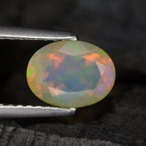 0.88캐럿 천연 멀티컬러 오팔, 타원형 컷, 8.1×6.1 mm, 투명한