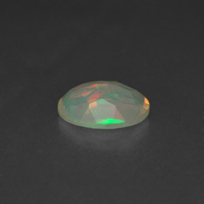 0.65캐럿 천연 멀티컬러 오팔, 투명한, 8.2×6.1 mm, 투명/반투명