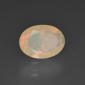 0.78캐럿 천연 멀티컬러 오팔, 타원형 컷, 8.4×6.2 mm, 투명한