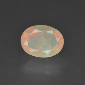 0.63캐럿 천연 멀티컬러 오팔, 타원형 컷, 7.9×6 mm, 투명한