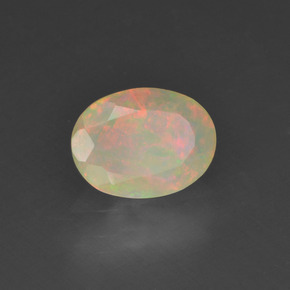 0.63캐럿 천연 멀티컬러 오팔, 타원형 컷, 7.9×6 mm, 투명한