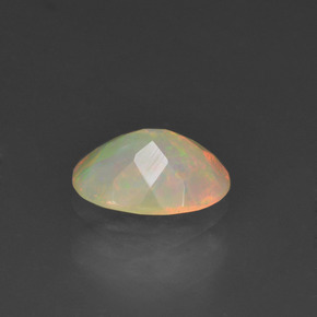 0.63캐럿 천연 멀티컬러 오팔, 타원형 컷, 7.9×6 mm, 투명한