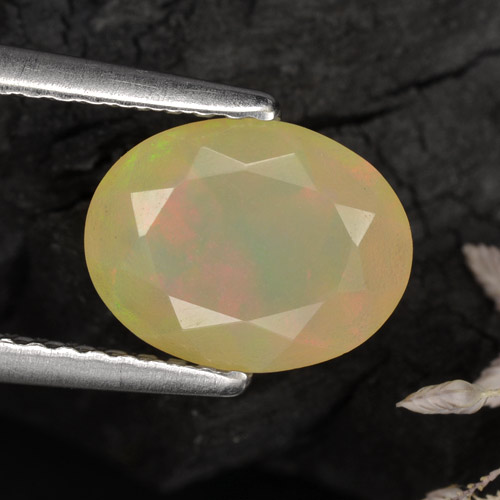 1.04캐럿 천연 멀티컬러 오팔, 타원형 컷, 9.1×7 mm, 투명한