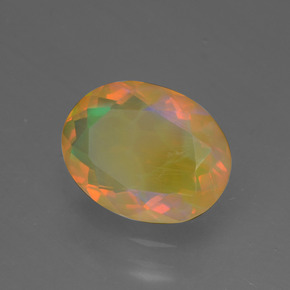 1.29캐럿 천연 멀티컬러 오팔, 타원형 컷, 9.7×7.5 mm, 투명한
