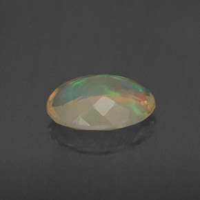 1.34캐럿 천연 멀티컬러 오팔, 타원형 컷, 10.2×7.7 mm, 투명한