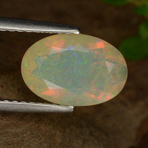 1.26캐럿 천연 멀티컬러 오팔, 타원형 컷, 10.6×7.2 mm, 투명한