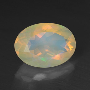 1.38캐럿 천연 멀티컬러 오팔, 타원형 컷, 9.9×7.2 mm, 투명한