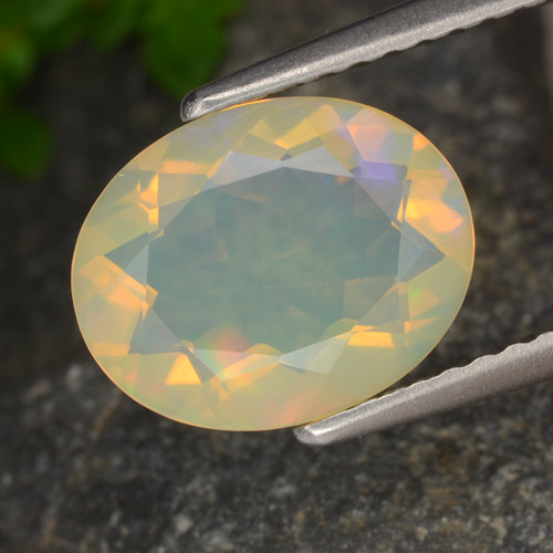 1.29캐럿 천연 멀티컬러 오팔, 타원형 컷, 10×8 mm, 투명한