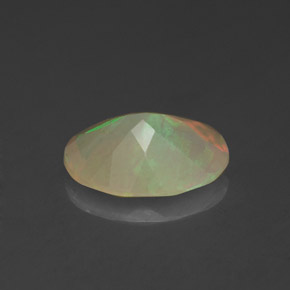 1.14캐럿 천연 멀티컬러 오팔, 타원형 컷, 9.9×7.8 mm, 투명한